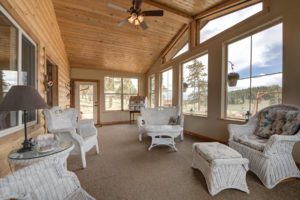 enclosed porch with wicker furniture