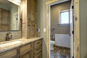 bathroom with wooden cabinets