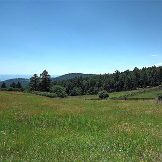 Looking east towards the building site and amazing pastures. View has to be seen in person, haze from western slope prevented the best impact